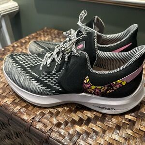 Nike Women's Black and White Sneakers with Pink Accents